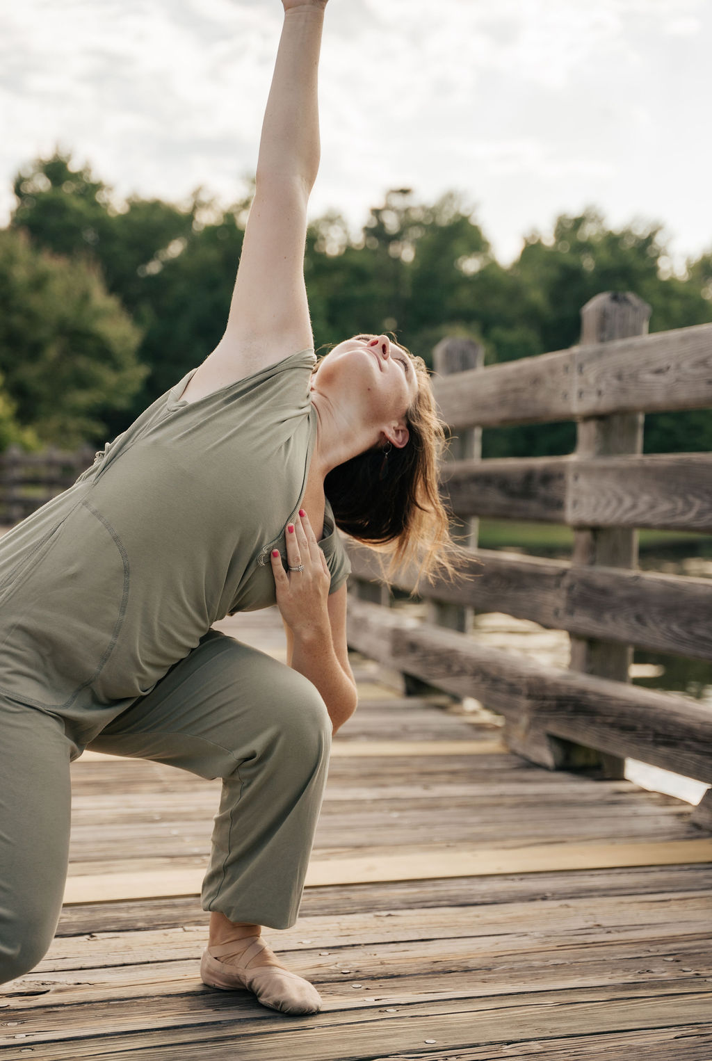A dancer arching into a high extension at golden hour