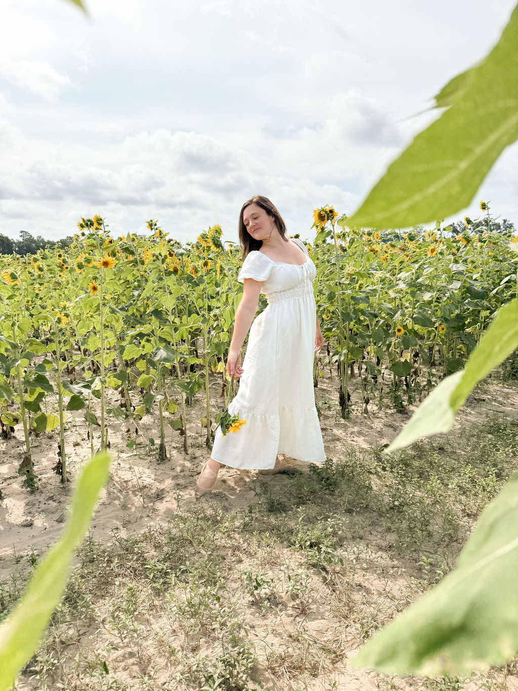 Women dancing outdoors in a field