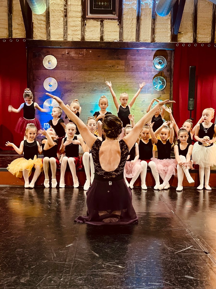 The class together on stage with their instructor at the spring recital