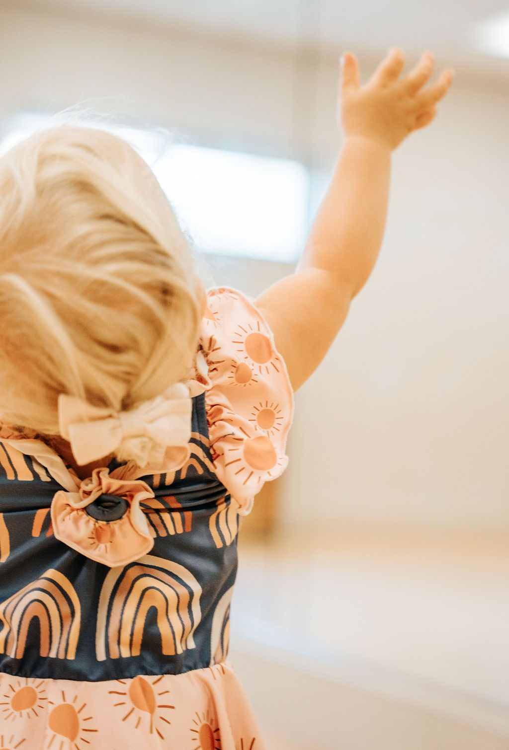 A young dancer with one arm lifted high in worship